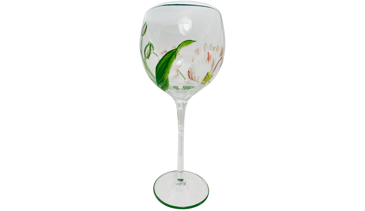 Hand Painted Peach Pink Flower Balloon Wine Glass featuring a broad green leaf, coral-edged peach blossoms, unopened buds, and painted stem details.