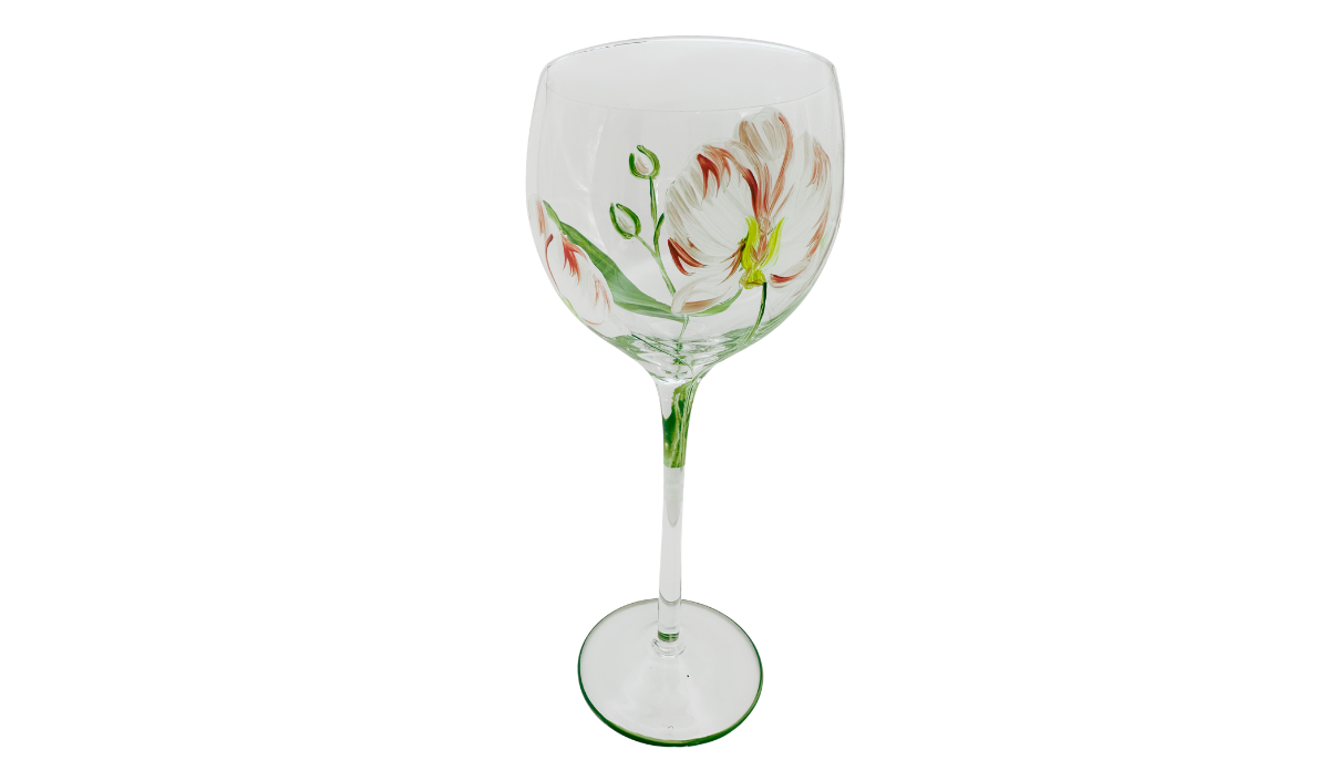Hand Painted Peach Pink Flower Balloon Wine Glass showing multiple peach-and-coral blossoms, unopened buds, curved green stems, and a green-edged circular foot.
