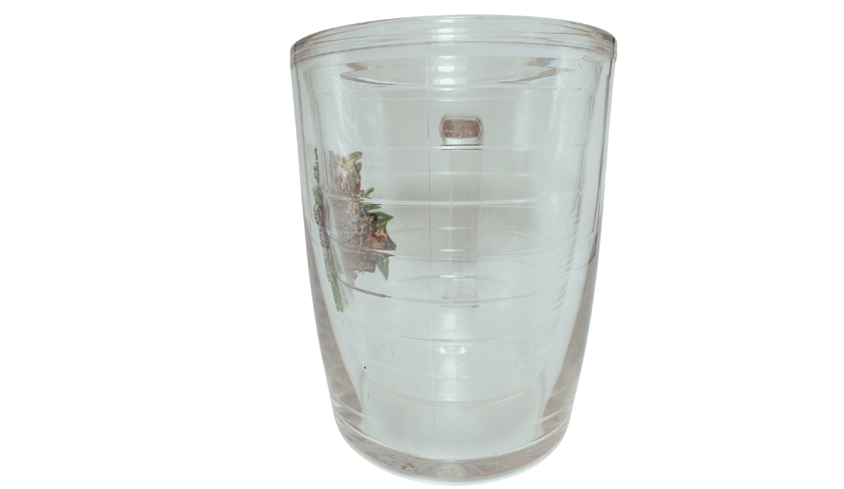 Tervis Margaritaville Red Parrot Mug middle view showing the clear insulated body opposite the handle, with partial tropical parrot artwork visible.