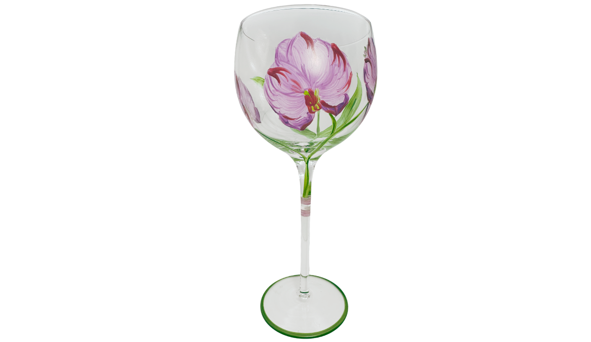 Hand Painted Purple Pink Flower Balloon Wine Glass front view with large lavender-pink blossom, plum petal accents, green leaves and green-edged foot.