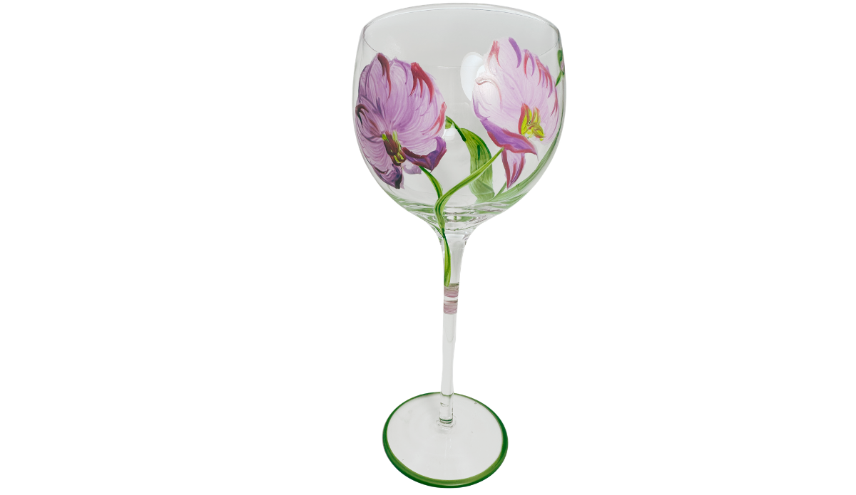 Hand Painted Purple Pink Flower Balloon Wine Glass side view showing two lavender and purple blossoms with plum accents, curved green stems and leaves.