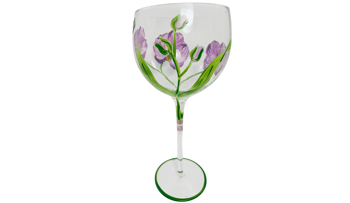 Hand Painted Purple Pink Flower Balloon Wine Glass showing deeper violet blossoms, unopened purple buds, branching green stems and long pointed leaves.