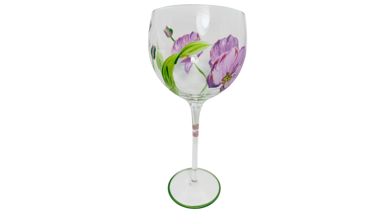 Hand Painted Purple Pink Flower Balloon Wine Glass showing overlapping purple blossoms, broad curved green leaf, small flower bud and painted stem.