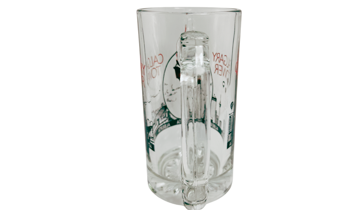 Calgary Tower Beer Mug handle view with large clear glass handle, wraparound skyline artwork, and patterned base