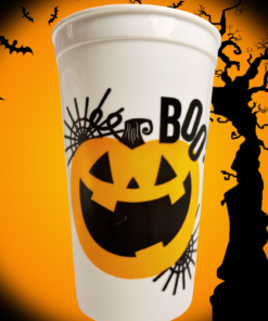 Boo Jack-O'-Lantern Halloween acrylic cup displayed against orange Halloween background with bats and spooky tree
