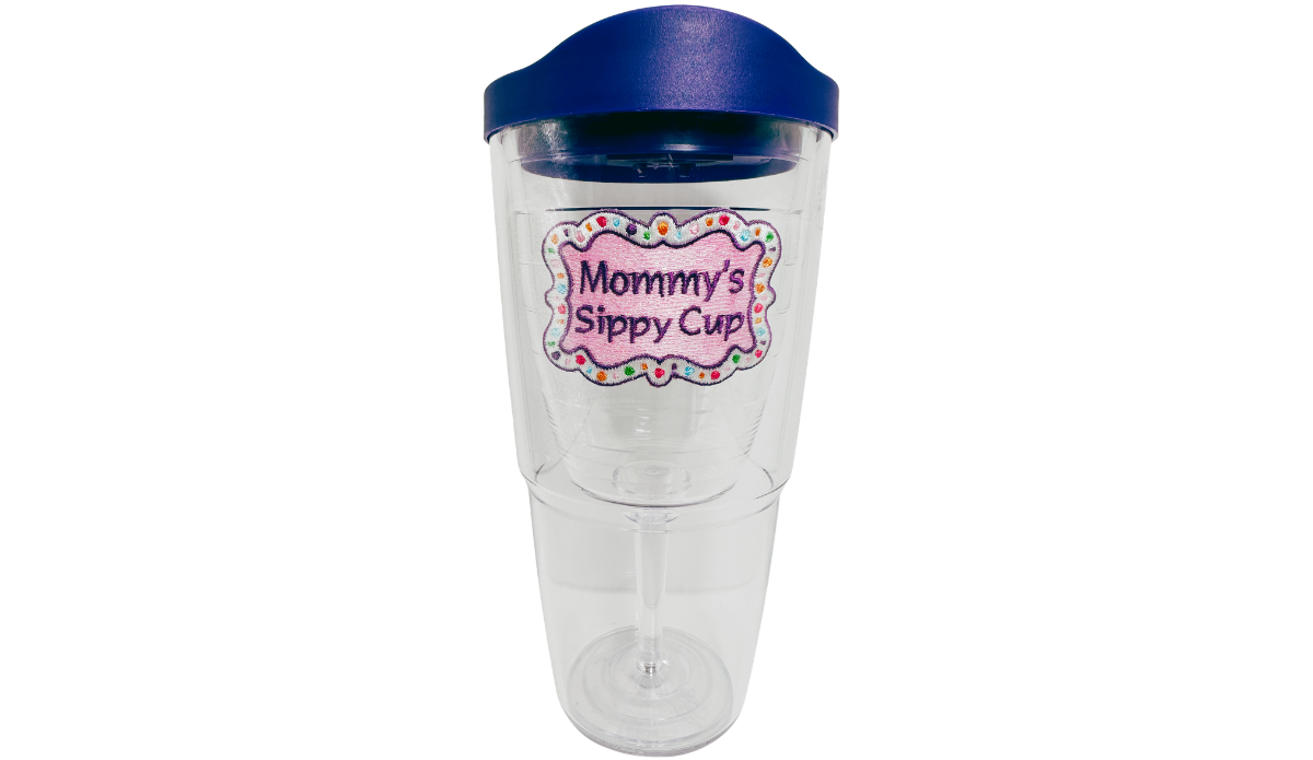 Tervis Mommy's Sippy Cup Tumbler With Lid front view showing pink embroidered-style emblem, purple lid and clear wine-glass-shaped interior.