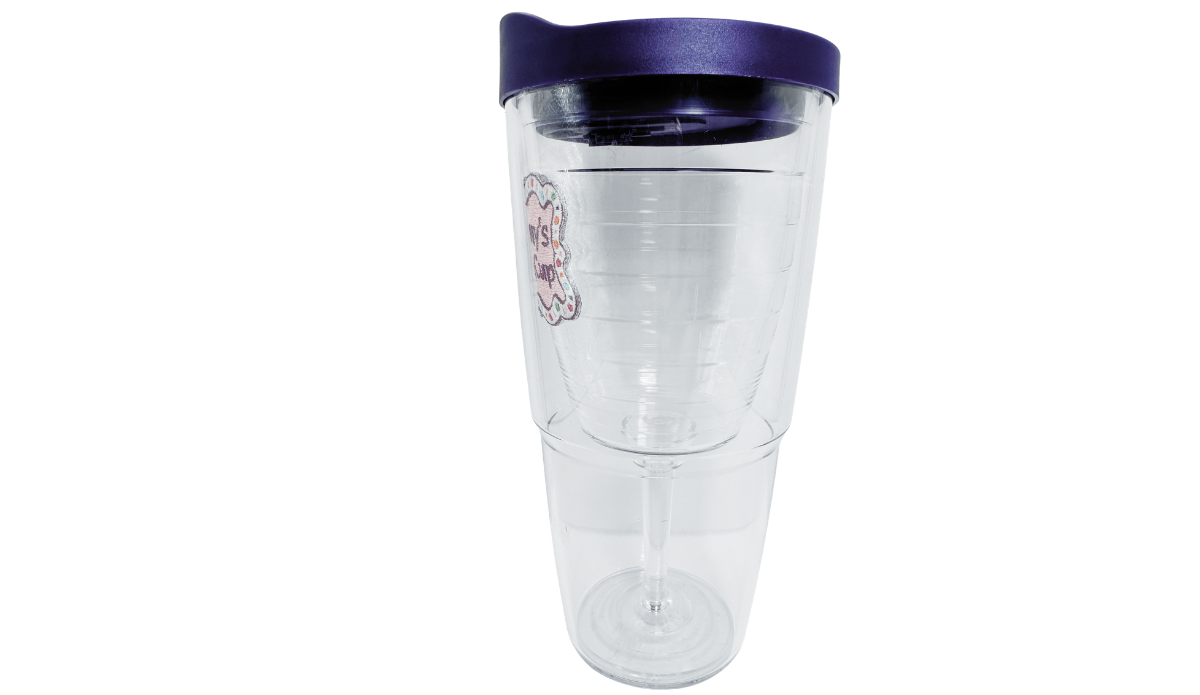 Tervis Mommy's Sippy Cup Tumbler With Lid side view featuring deep purple travel lid, partial pink emblem and visible inner wine-glass shape.
