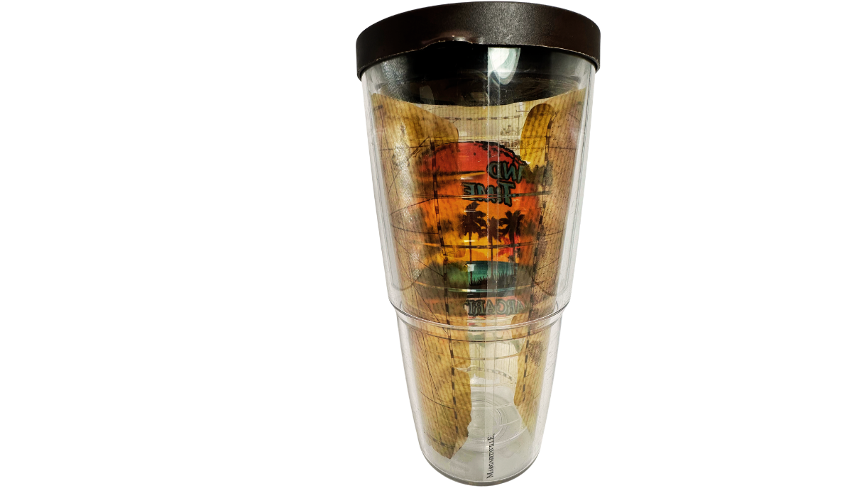 Back view of Tervis Margaritaville Island Time Tumbler With Lid revealing reversed sunset lettering, tropical palms, vintage map artwork, and clear insulated body.