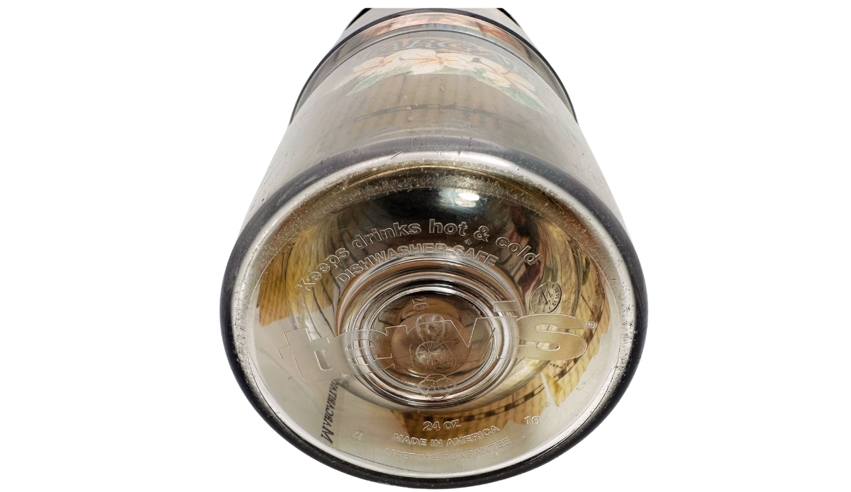 Bottom view of Tervis Margaritaville Island Time Tumbler showing 24 oz capacity, Tervis branding, dishwasher-safe marking, and Made in America lettering.
