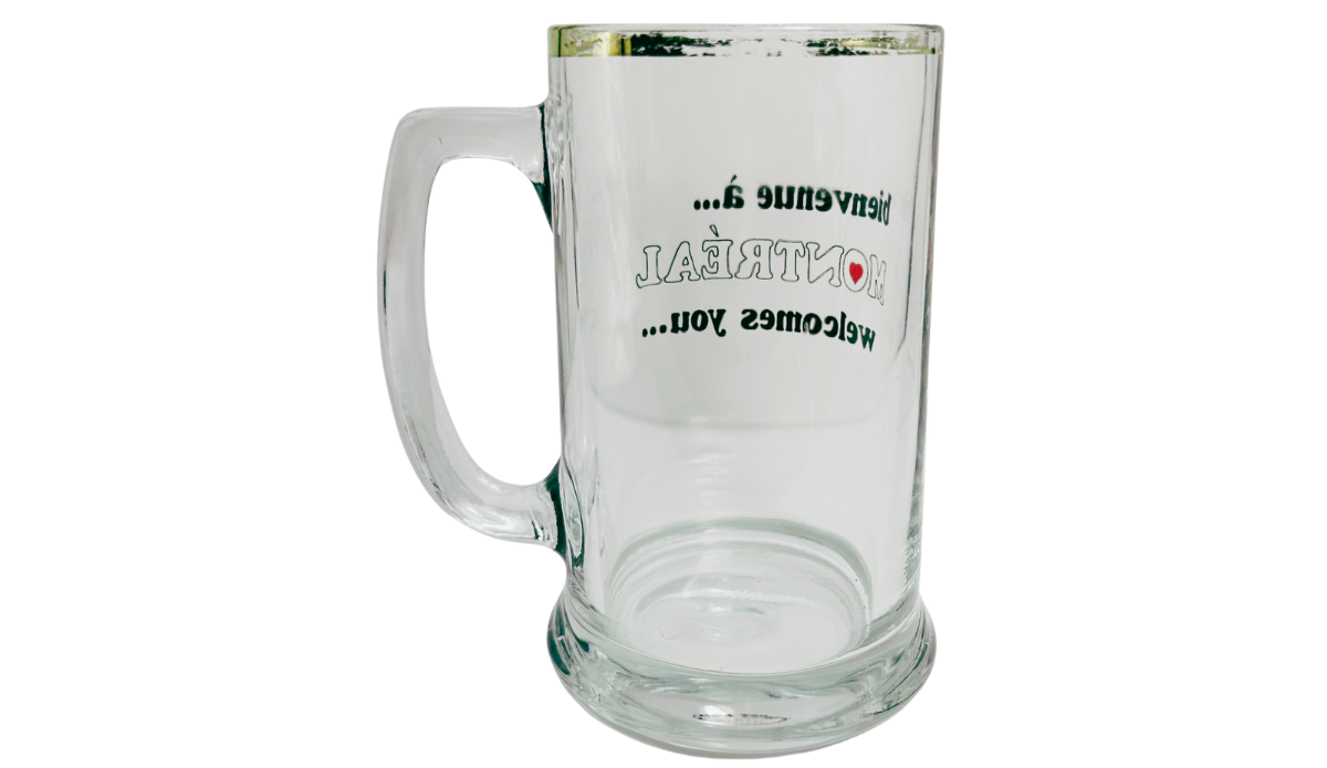 Vintage Montreal Beer Mug back view with reverse bilingual lettering, clear glass handle, and gold-tone rim