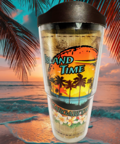 Tervis Margaritaville Island Time Tumbler With Lid displayed against tropical ocean waves, colorful sunset skies, and silhouetted palm fronds.