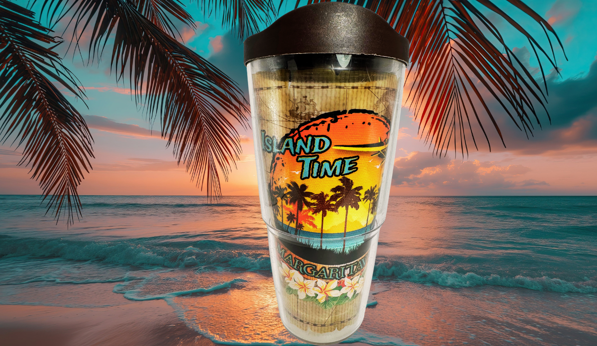 Tervis Margaritaville Island Time Tumbler With Lid displayed against tropical ocean waves, colorful sunset skies, and silhouetted palm fronds.