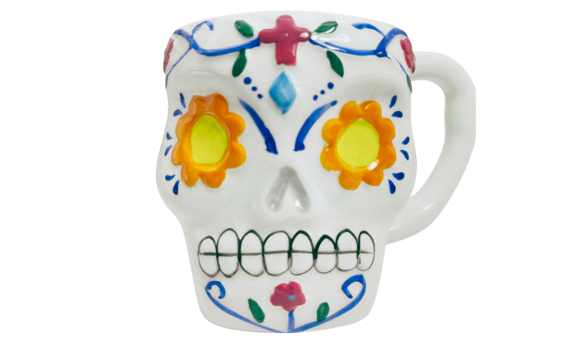 Floral Sugar Skull Mug with yellow and orange flower eyes, blue scrollwork, colorful flowers, and sculpted teeth