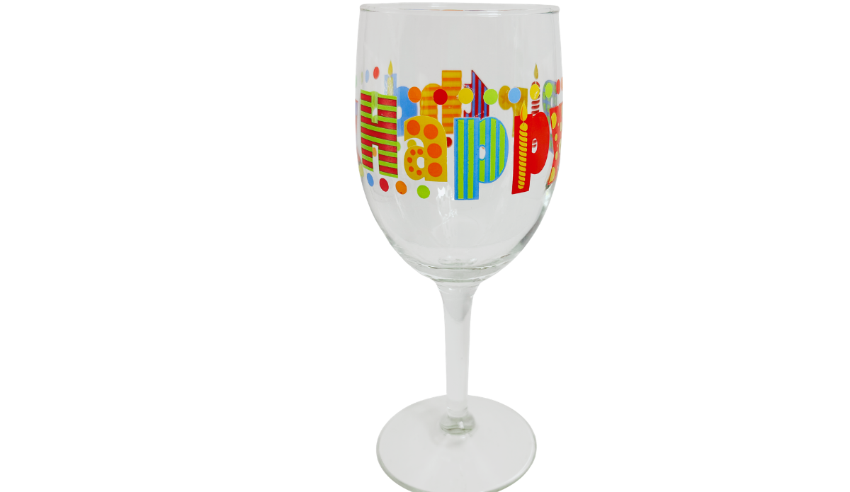 Happy Birthday Colorful Lettering Wine Glass showing large patterned Happy letters, colorful candles, and decorative dots.