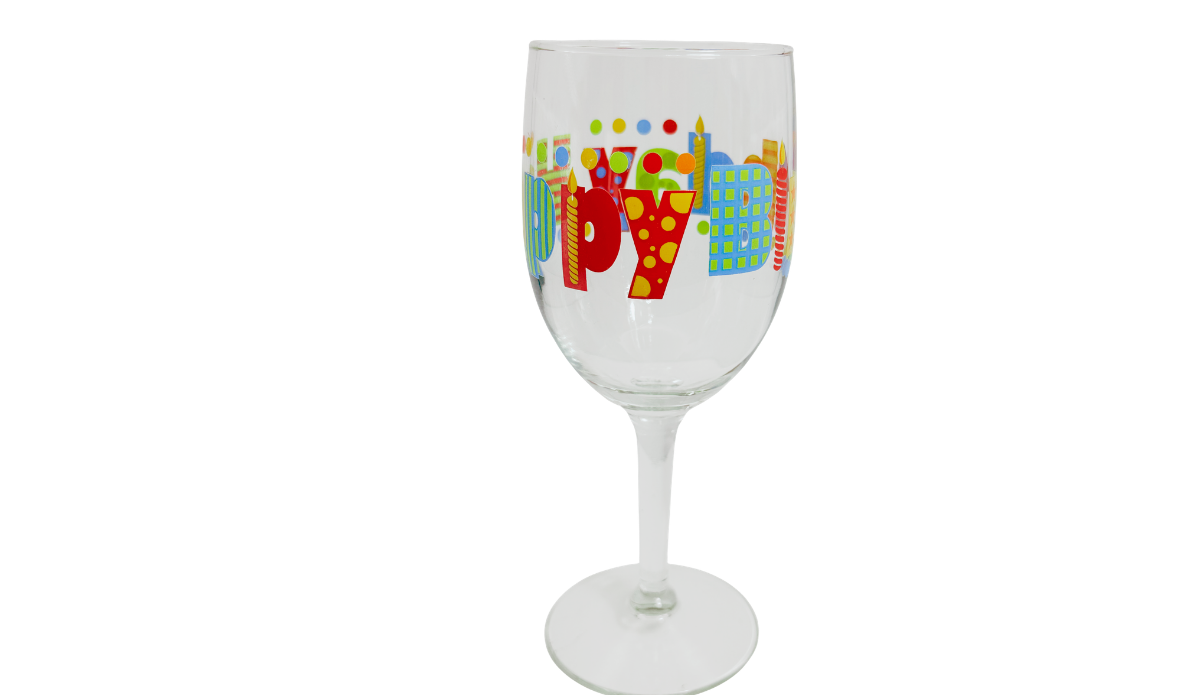 Side view of Happy Birthday Colorful Lettering Wine Glass showing red and yellow patterned letters, blue accents, and birthday candles.
