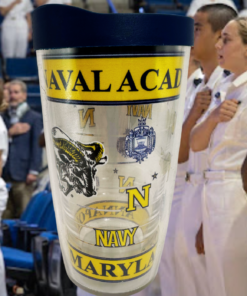 Tervis United States Naval Academy Tumbler With Lid displayed against a Naval Academy midshipmen ceremony scene, featuring blue-and-gold Navy artwork.