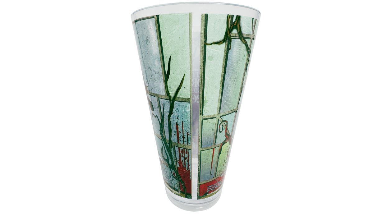 Back view of HHN 2025 Souvenir Cup with broken window panels, dark branches, and red horror accents