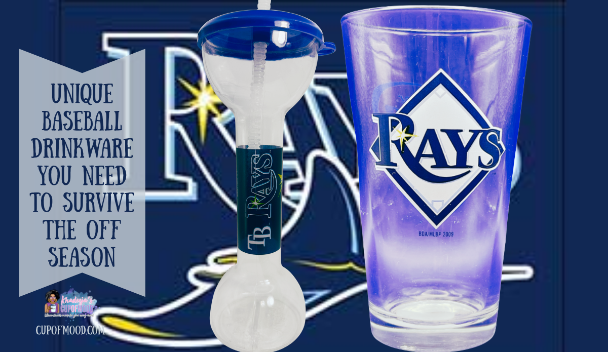 Tampa Bay Rays Whirley souvenir yard cup with blue lid and straw beside a 2009 Rays pint glass against oversized team logo artwork.