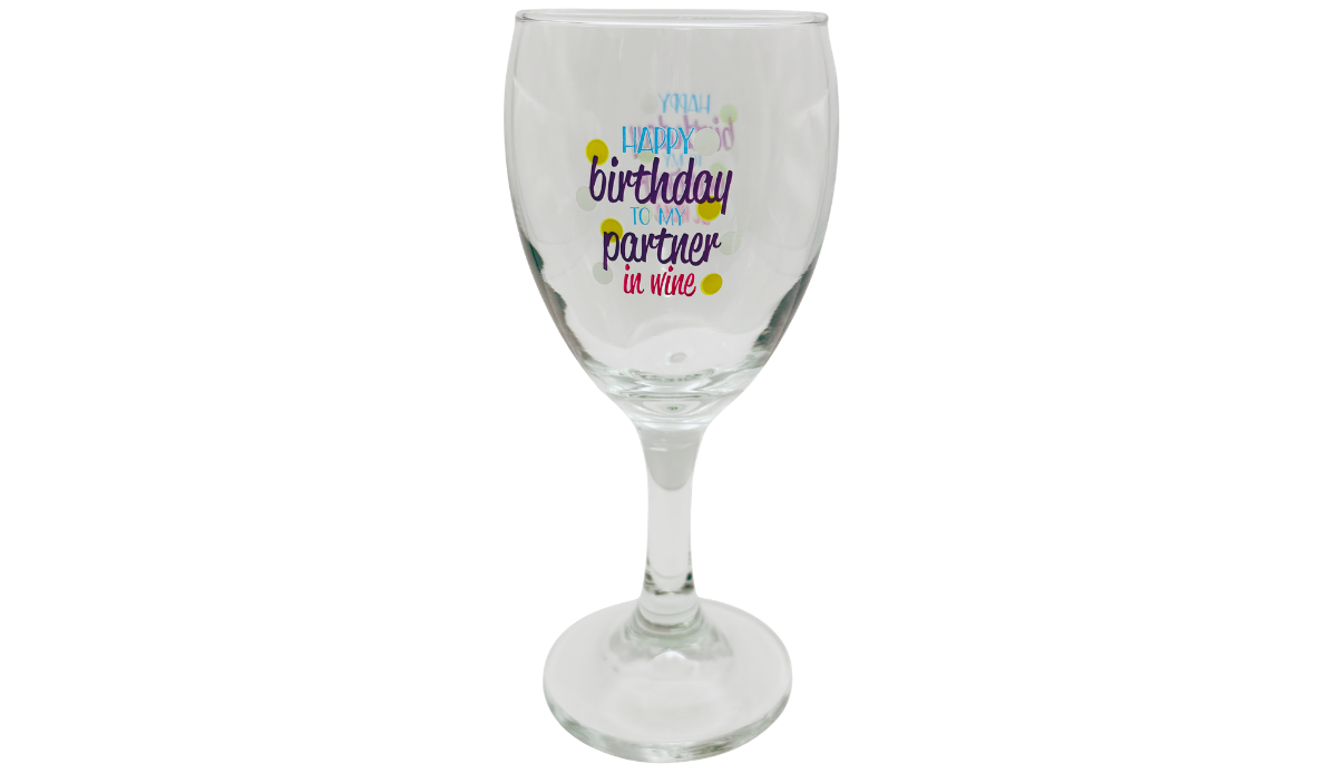 Happy Birthday Partner In Wine Glass front view with colorful birthday lettering, purple script, pink in wine message, and decorative dots.