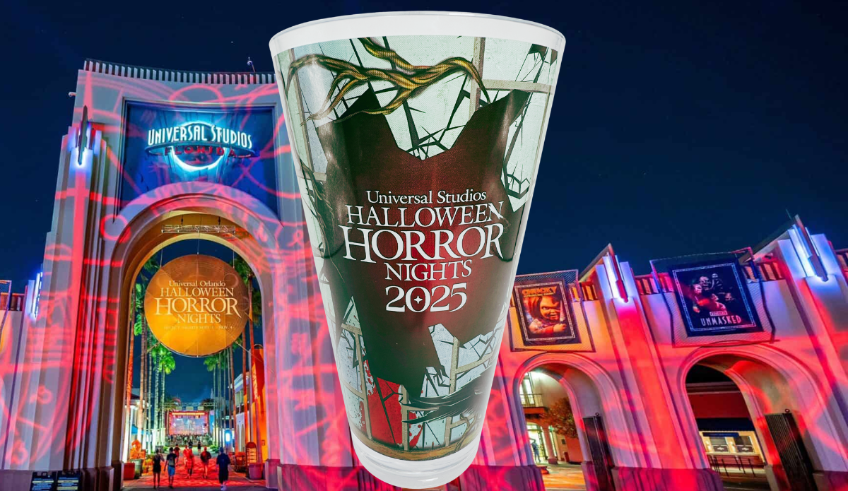Halloween Horror Nights 2025 Souvenir Cup displayed in front of the illuminated Universal Studios entrance at night