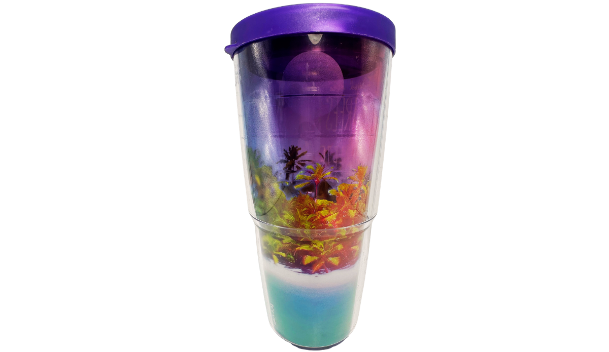 Left side view of Tervis Palm Trees Cool Breeze Tumbler displaying colorful tropical palms, purple sky, bright foliage, turquoise water, and purple lid.