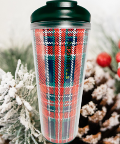 2017 Starbucks Christmas Tartan Plaid Tumbler displayed with snowy evergreen branches and red berries